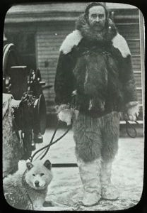 Image of Robert Peary in Furs with Dog on Deck of S.S. Roosevelt